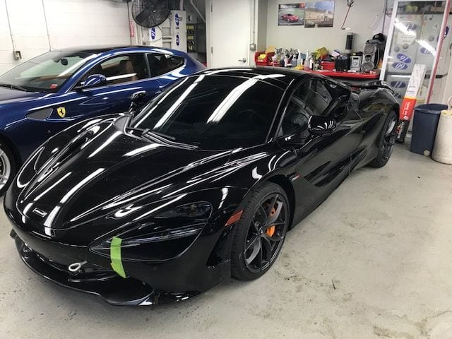 Black sports car with window film applied to all windows